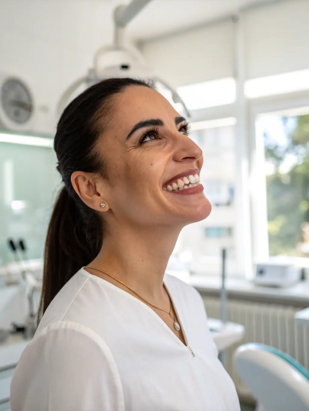 A close-up shot of a patient smiling confidently after receiving dental implants at Ata Dent Clinic, showcasing natural-looking results.