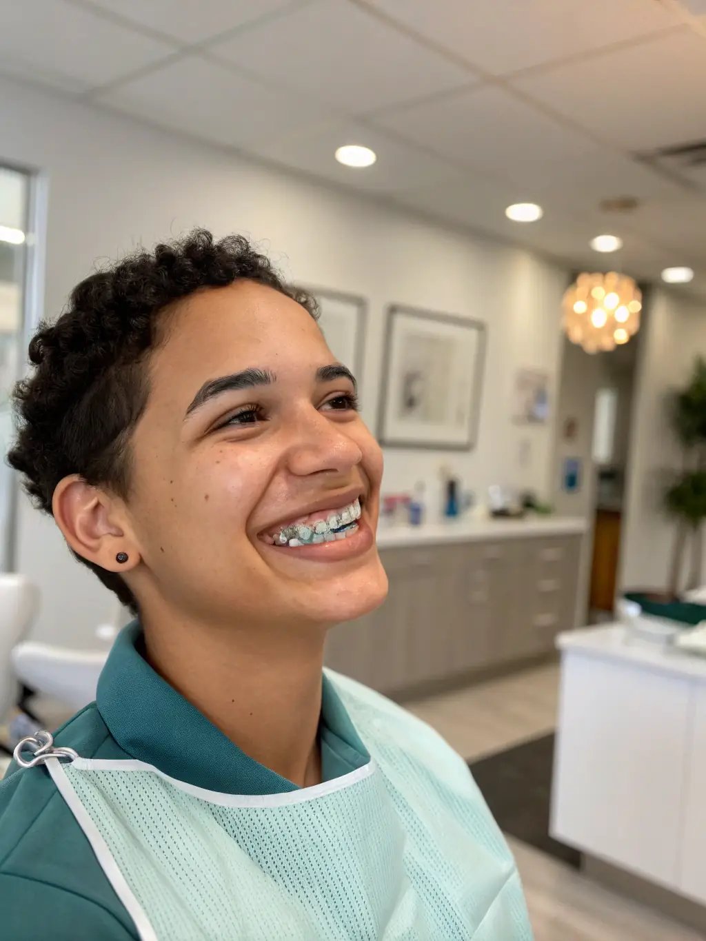 A dentist carefully adjusting clear aligners on a patient's teeth at Ata Dent Clinic, highlighting the precision and comfort of orthodontic treatment.